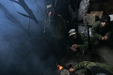 A field-kitchen of a block post in Gal region next to the frontier in the upper part of the  Kodora canyon, Abkhasia, Thursday, March 16, 2006. Several soldiers from the special forces in Abhasia are at the military service in the GALA district. At this block post meals are cooked in the campfire, game is also smoked there suspended from wooden hooks.