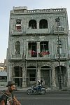 Buildings on the shore often get wrecked during storms. The coastline is the walking zone for tourists and locals, a place for morning runs, a meeting place of  street musicians, children and freelance artists. Habana, Cuba, Thursday, Feb. 22, 2007.