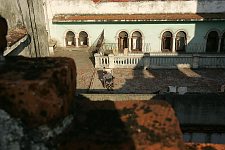 Sun-lit verandah. Habana, Cuba, Sunday, Feb. 25, 2007. A beautiful building of a former convent was turned into an old people’s home in 1965. Old people without families and those who are unable to move live here permanently. The rest come for breakfast and return home for the night. Every week elderly people hold theatre shows or recitals, where guest artist or inhabitants themselves perform.