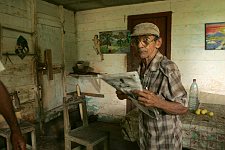 An old man in his house. In small towns free of tourists the rate of life is quite different. Baracoa, Cuba, Saturday, March 3, 2007.
