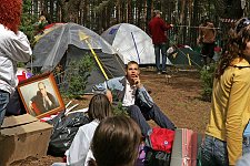 Activist of the pro-Kremlin Nashi (Ours) youth movement from Briansk near the portrait of Vladimir Putin in the Nashi summer camp on Lake Seliger, some 300 kilometres (~180 miles) northwest of Moscow, Sunday, July 15, 2007. Pro-Kremlin Nashi (Ours) youth movement has assembled about 10 thousand young people from all over Russia to a summer camp where they are going to do sports and attend political and socially oriented lectures and training sessions for two weeks.