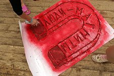 Activists of the pro-Kremlin Nashi (Ours) youth movement drawing propoganda visual aids in the Nashi summer camp on Lake Seliger, some 300 kilometres (~180 miles) northwest of Moscow, Sunday, July 15, 2007. Pro-Kremlin Nashi (Ours) youth movement has assembled about 10 thousand young people from all over Russia to a summer camp where they are going to do sports and attend political and socially oriented lectures and training sessions for two weeks.