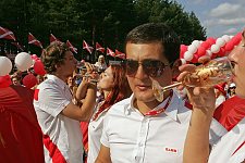 Group wedding ceremony in the camp. More than 25 couples got married at the same time, and following the call of president Putin to inprove the demography situation in Russia, promised to give birth to 3 children or more. The Nashi summer camp on Lake Seliger, some 300 kilometres (~180 miles) northwest of Moscow, Wednesday, July 18, 2007. Pro-Kremlin Nashi (Ours) youth movement has assembled about 10 thousand young people from all over Russia to a summer camp where they are going to do sports and attend political and socially oriented lectures and training sessions for two weeks.
