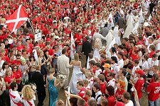 Group wedding ceremony in the camp. More than 25 couples got married at the same time, and following the call of president Putin to inprove the demography situation in Russia, promised to give birth to 3 children or more. The Nashi summer camp on Lake Seliger, some 300 kilometres (~180 miles) northwest of Moscow, Wednesday, July 18, 2007. Pro-Kremlin Nashi (Ours) youth movement has assembled about 10 thousand young people from all over Russia to a summer camp where they are going to do sports and attend political and socially oriented lectures and training sessions for two weeks.