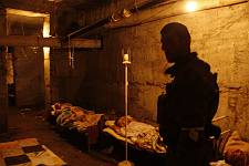Patients in the basement of the ruined hospital, Monday August 11, 2008. 