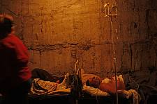 Patients in the basement of the ruined hospital, Monday August 11, 2008. 