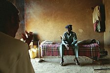 The elderly policeman at home. The police station El Imam Malik in the Omdurman, the suburb of the capital. Khartoum, Sudan. Monday, Dec. 22, 2003.