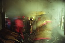 Firemen in the house which has just suffered a fire. St. Petersburg, Russia, February, 2004.