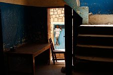 The visiting boy looking into the suspects cell. Hargeisa, SomaliLand, Wednesday, October 10, 2007. The police station named New Hargeisa is situated in one of the most criminal districts of the capital with its largest market and railway terminal.