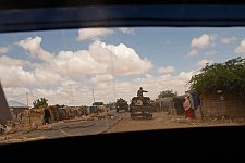 The military convoy bypassing the barrier of boulders and tree trunks made by the villagers supporting the opposite side. Los Anod, SomaliLand, Monday, October 15, 2007. The military constantly camp near Los Anod in the province of  SomaliLand, bordering on PuntLand. Fighting is resumed at this territory from time to time.
